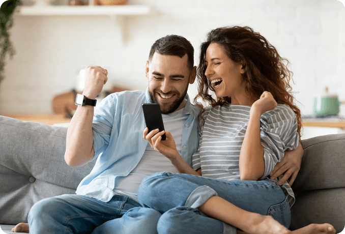 Happy couple celebrating successful experience with YupUp local rewards